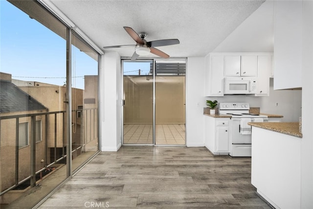 kitchen with white cabinetry, ceiling fan, white appliances, wood-type flooring, and a textured ceiling