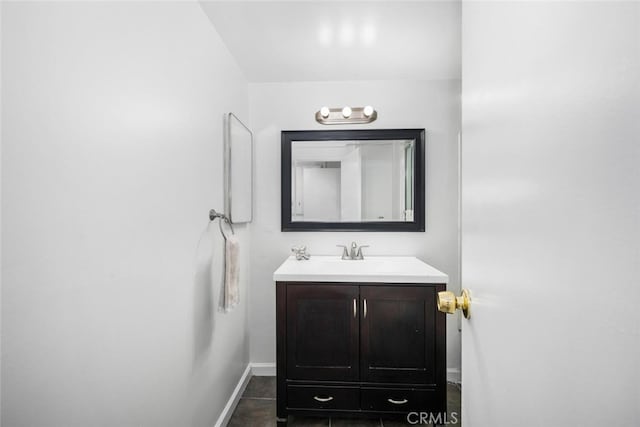 bathroom with tile patterned floors and vanity