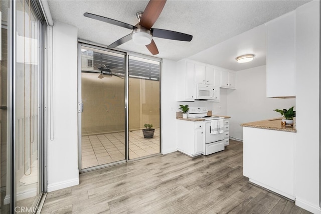 kitchen with white appliances, a textured ceiling, white cabinetry, ceiling fan, and light hardwood / wood-style flooring