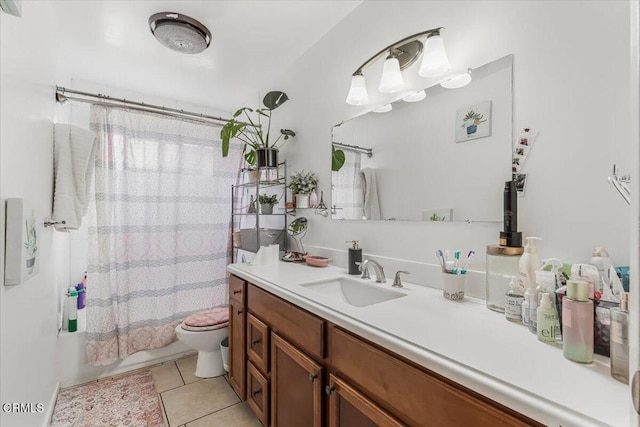 full bathroom featuring vanity, tile patterned floors, shower / bath combo with shower curtain, and toilet