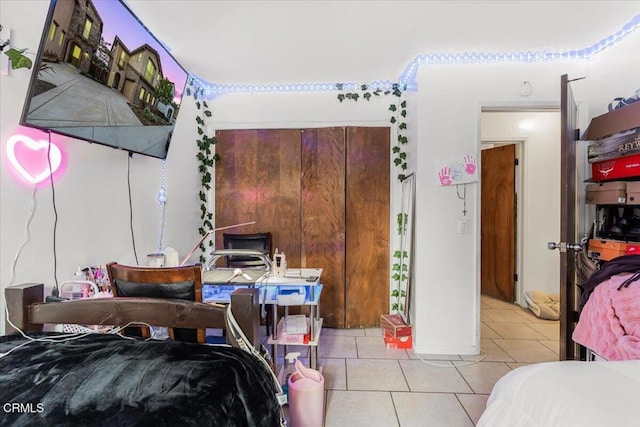 bedroom featuring light tile patterned floors