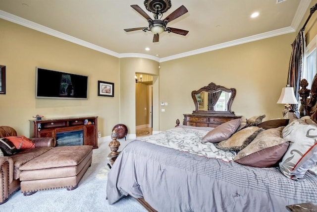 bedroom featuring light colored carpet, ceiling fan, and crown molding