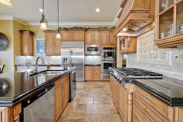 kitchen featuring built in appliances, custom exhaust hood, hanging light fixtures, tasteful backsplash, and sink