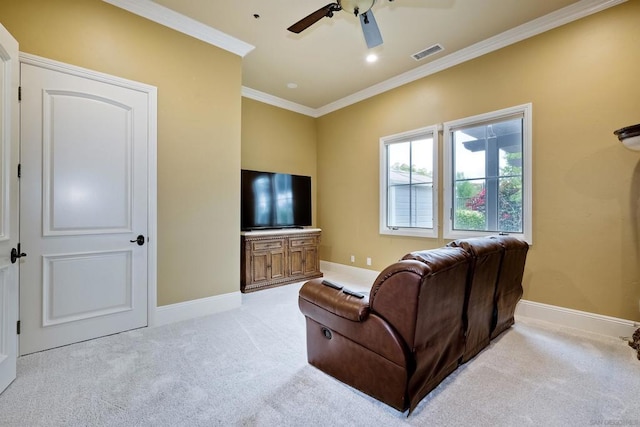 living room with light colored carpet, ceiling fan, and crown molding