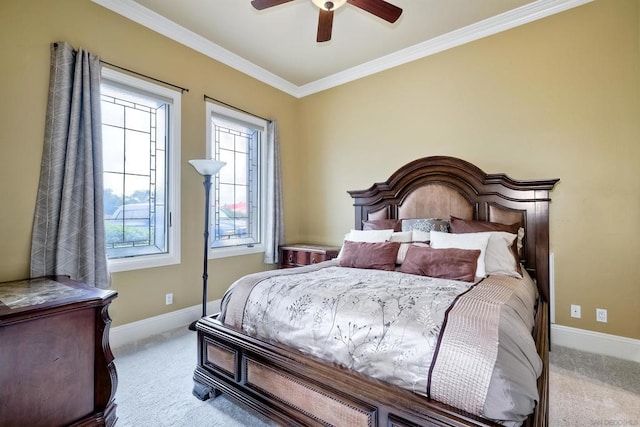 carpeted bedroom featuring ornamental molding and ceiling fan