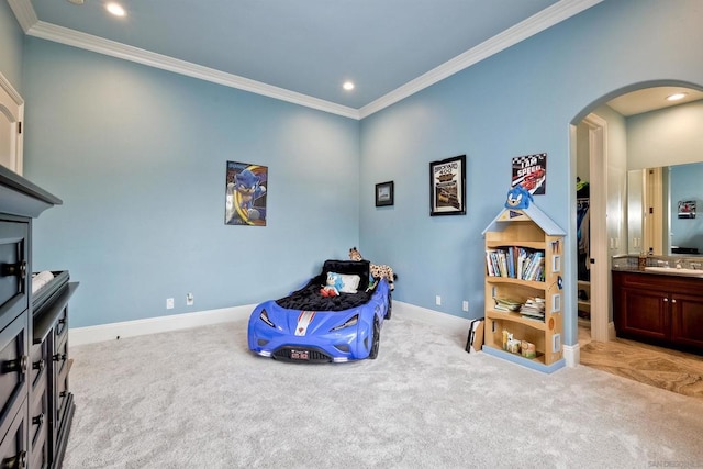 interior space with sink, crown molding, and light colored carpet