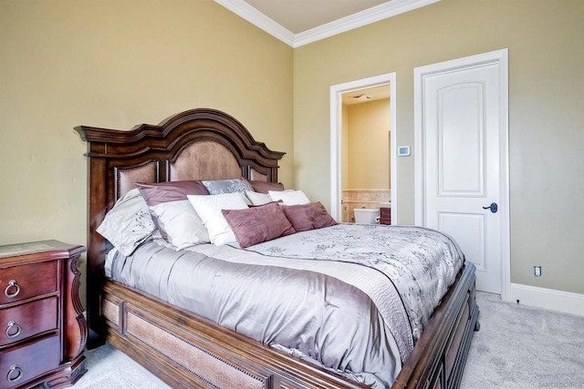 bedroom featuring ensuite bath, light colored carpet, and ornamental molding