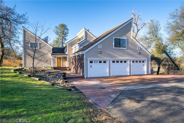 front of property with a front lawn and a garage