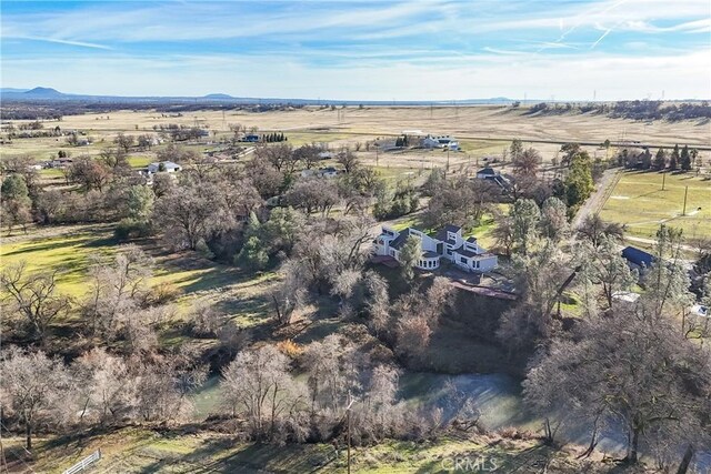 drone / aerial view with a mountain view and a rural view