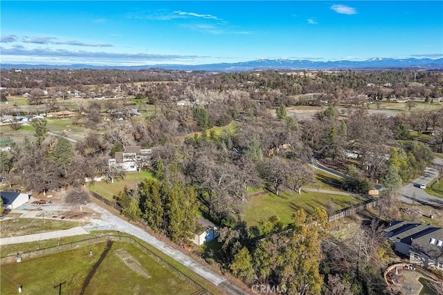 birds eye view of property featuring a mountain view