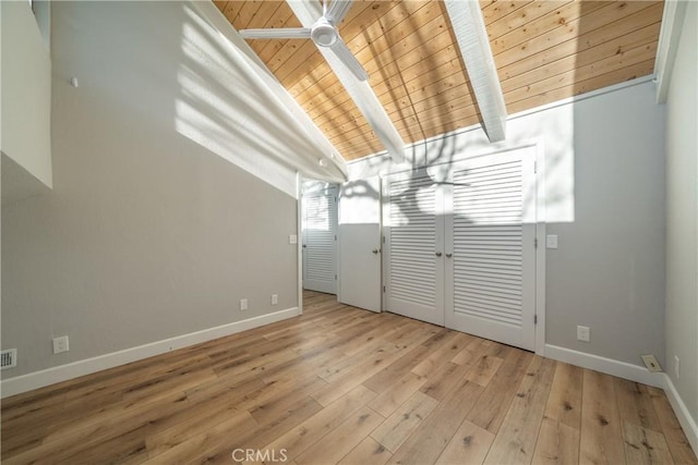 interior space with wooden ceiling, light hardwood / wood-style flooring, and lofted ceiling with beams