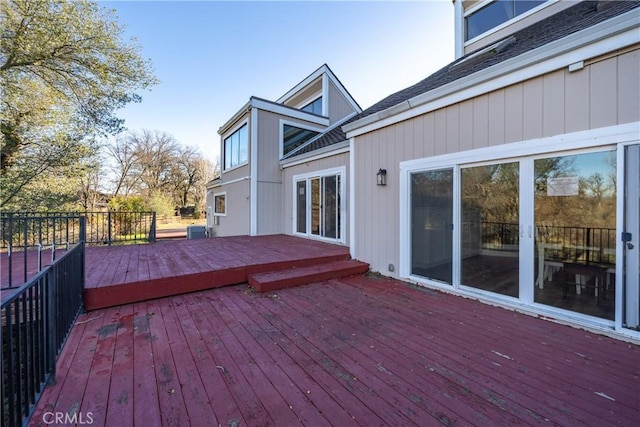 wooden deck featuring central AC unit