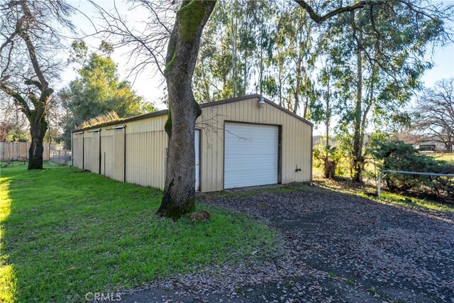 garage featuring a yard