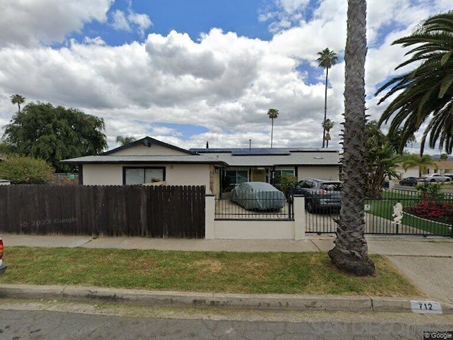 view of front of house featuring solar panels