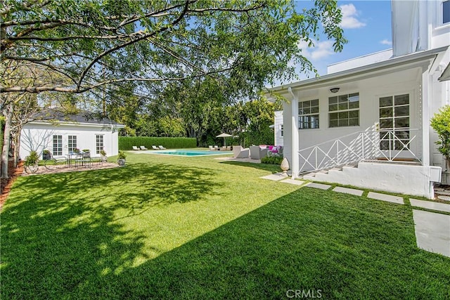 view of yard with a fenced in pool, an outdoor hangout area, and a patio