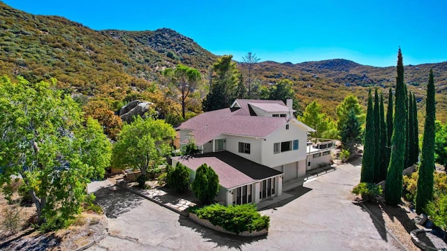 birds eye view of property with a mountain view