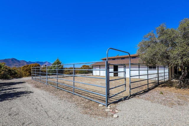 view of stable featuring a mountain view