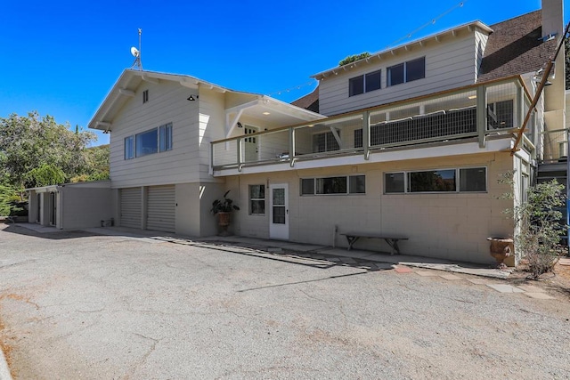 rear view of house featuring a balcony