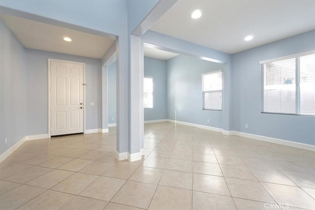 interior space featuring a healthy amount of sunlight and light tile patterned floors