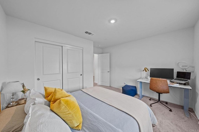 carpeted bedroom featuring a closet