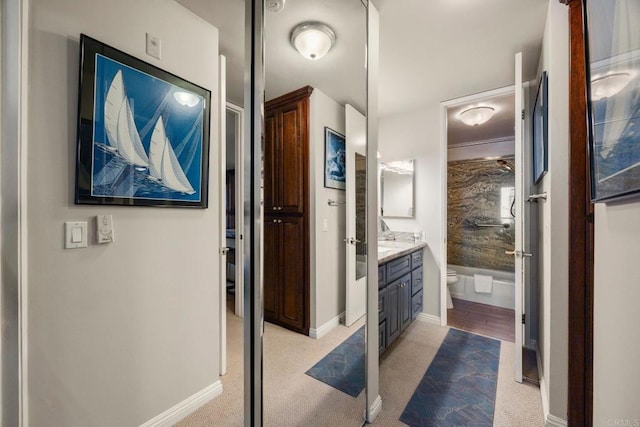 bathroom featuring toilet and vanity