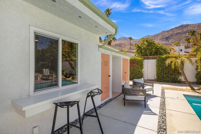 view of patio / terrace featuring a mountain view