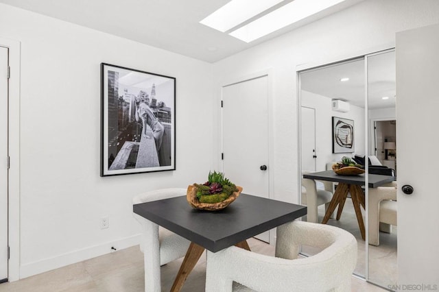 dining space featuring a skylight