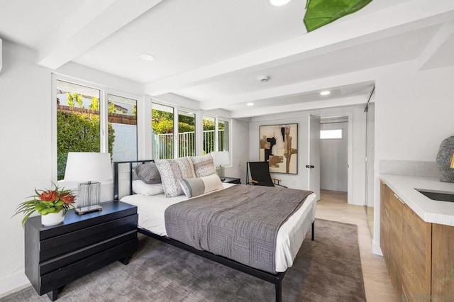 bedroom with beam ceiling