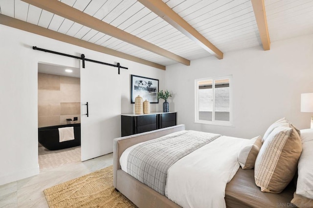 bedroom with beam ceiling and a barn door