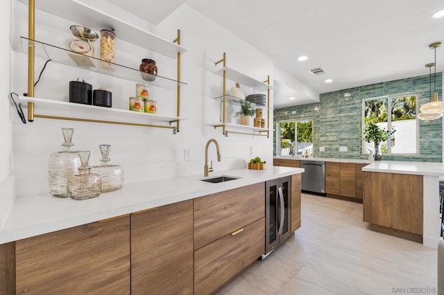 bar featuring beverage cooler, dishwasher, decorative light fixtures, sink, and backsplash