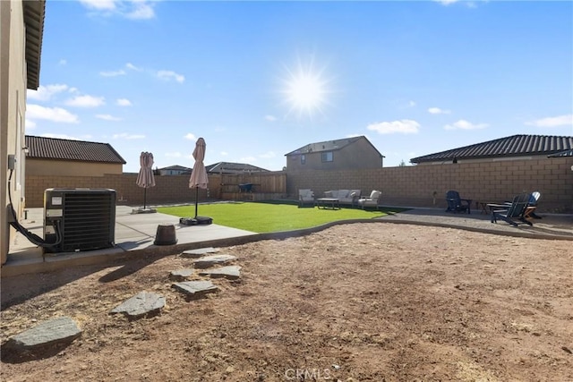 view of yard with a patio area and central AC unit