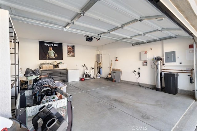 garage with electric panel and a garage door opener