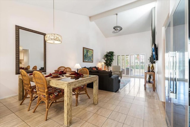 tiled dining space with high vaulted ceiling and beamed ceiling