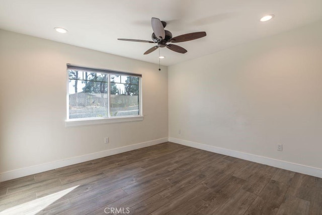 empty room featuring ceiling fan and hardwood / wood-style floors