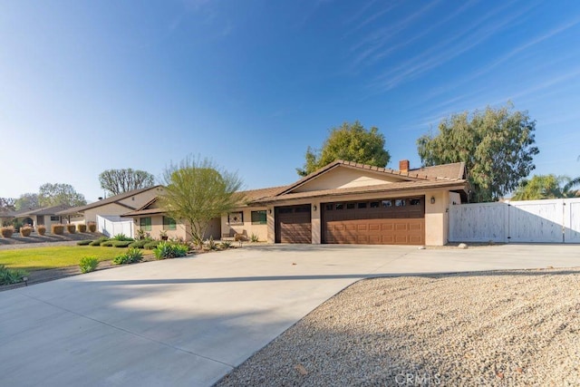 ranch-style home featuring a garage