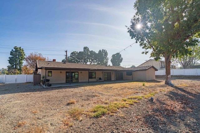 rear view of property with a patio