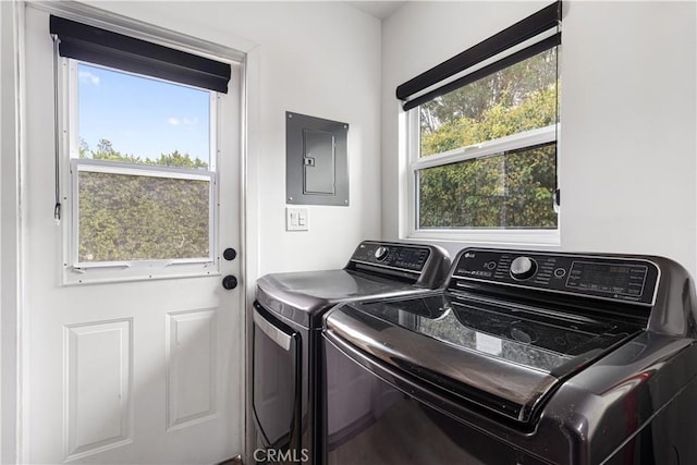 washroom with electric panel and independent washer and dryer