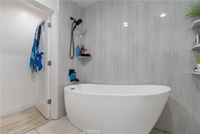 bathroom featuring separate shower and tub