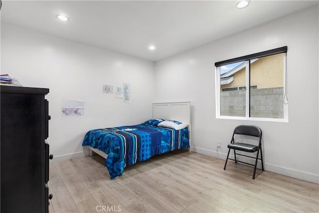 bedroom with light wood-type flooring