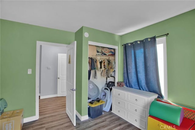 bedroom featuring a closet and light hardwood / wood-style flooring