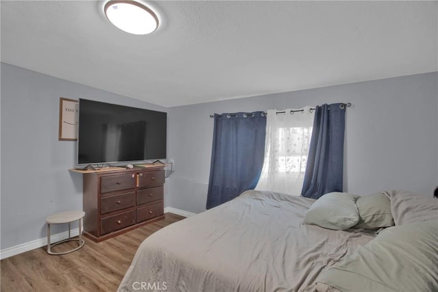 bedroom featuring light wood-type flooring