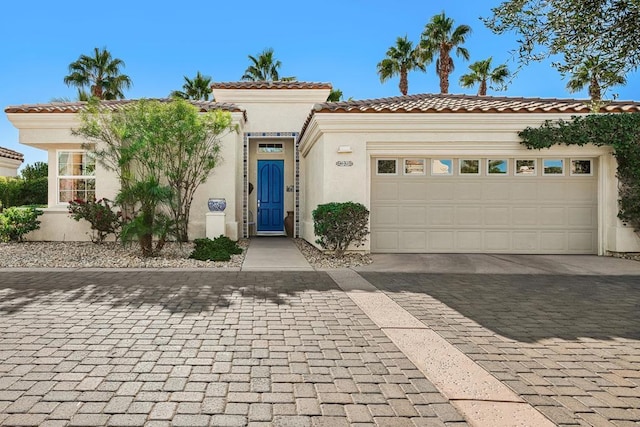 mediterranean / spanish-style home featuring a garage