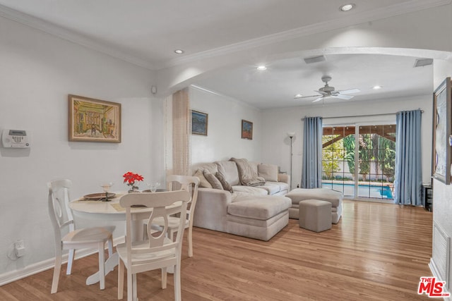 dining room with ceiling fan, crown molding, and light hardwood / wood-style flooring