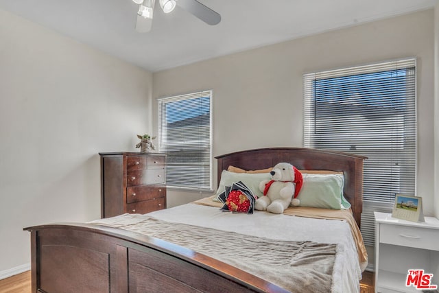 bedroom with light wood-type flooring and ceiling fan