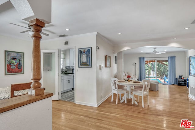 dining area featuring ceiling fan, crown molding, and light hardwood / wood-style flooring