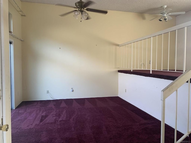 spare room featuring ceiling fan, a textured ceiling, and carpet flooring