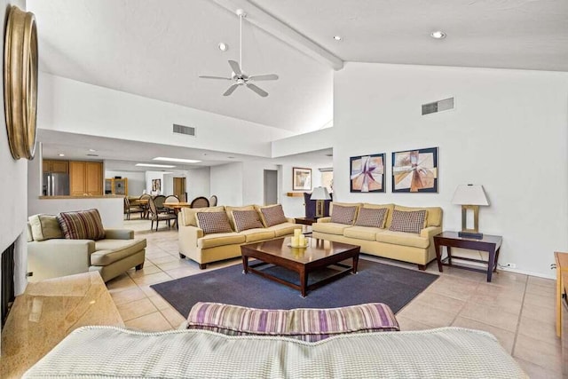 living room featuring ceiling fan, high vaulted ceiling, beam ceiling, and light tile patterned flooring