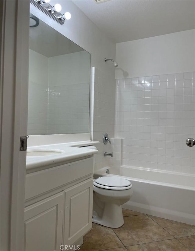 full bathroom featuring toilet, vanity, bathtub / shower combination, and tile patterned floors