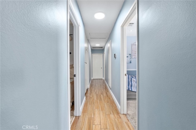 hallway featuring light hardwood / wood-style flooring