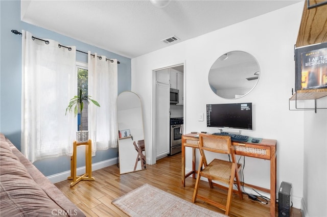 home office featuring light hardwood / wood-style flooring